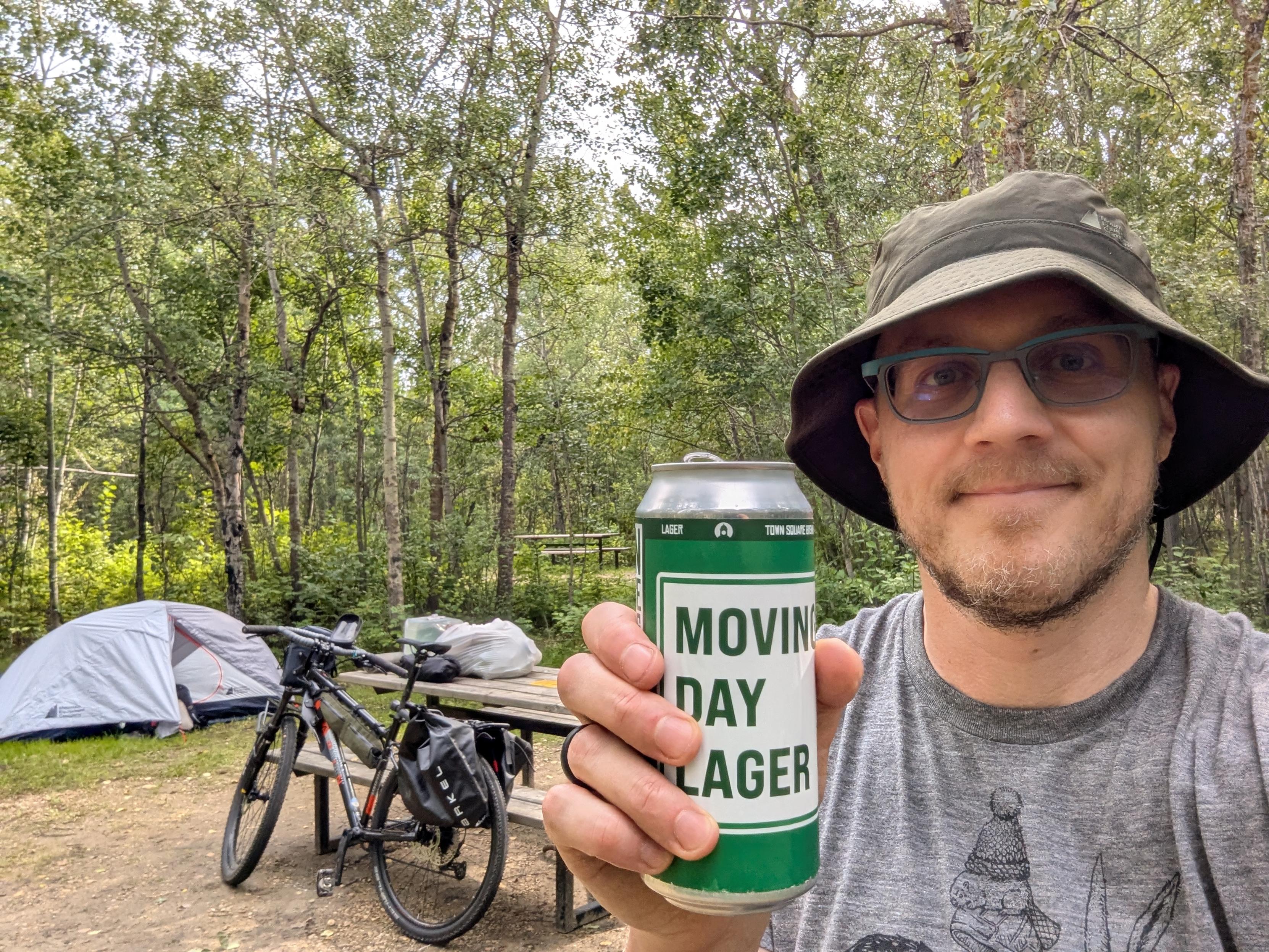 Similar to the previous photo, but includes a selfie of myself in a wide-brimmed bucket hat holding up a beer can (Moving Day Lager from Town Square Brewing). I'm looking very satisfied and accomplished.